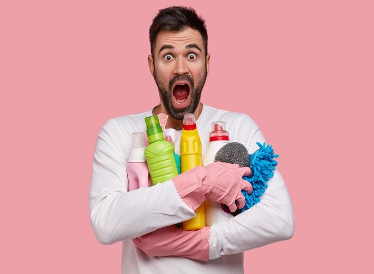 isolated-shot-stupefied-bearded-emotional-man-carries-bottles-detergents-closely-stares-with-unbeliveable-expression-dressed-casually